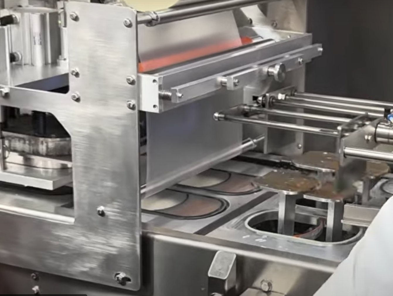 Discover the versatility of our Die Cut Tray Sealer, complete with a scrap take-up system for streamlined packaging. This machine is ideal for hand-loaded applications, ensuring precise seals with minimal waste. Perfect for food producers looking to boost efficiency and maintain product integrity.