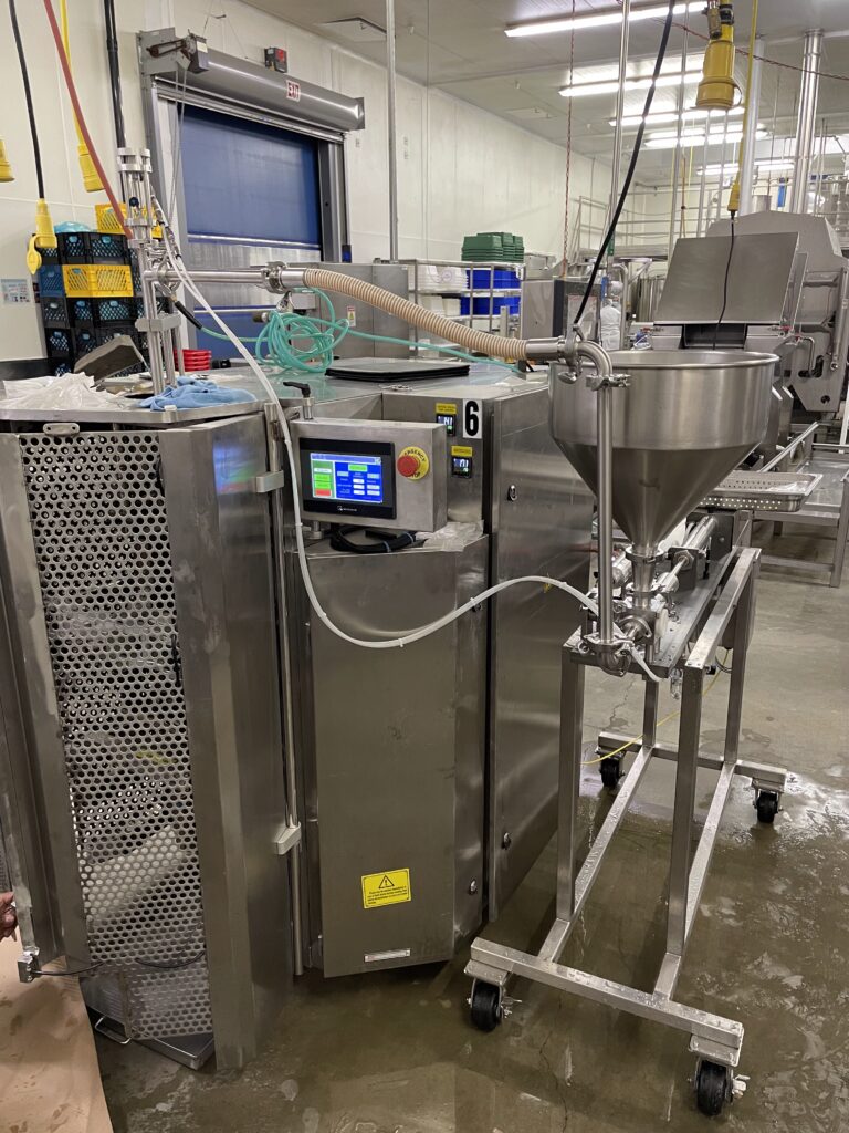 piston filler in facility a piston filler in a food manufacturing facility